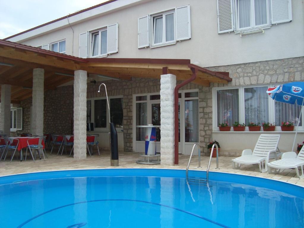 Vila Punta - pool, terrace and the house by the Adriatic Sea in Tribanj, Croatia